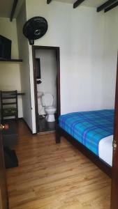 Giường trong phòng chung tại Hotel Paraíso