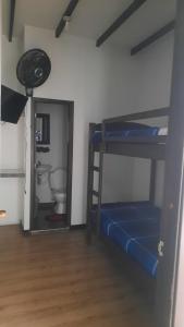 Giường trong phòng chung tại Hotel Paraíso