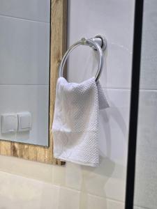 a towel hanging on a towel rack in a bathroom at Scenic Tamraght Cozy Studio in Agadir +54 photos
