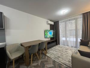 TV a/nebo společenská místnost v ubytování Ski cosy apartment 5