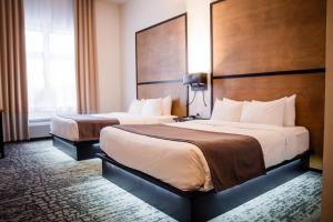 Voodi või voodid majutusasutuse AX Hotel toas