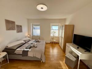 Postel nebo postele na pokoji v ubytování revLIVING Haus Clara am Berg mit kleinem Garten