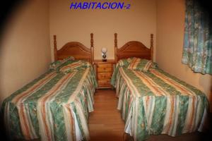 Postel nebo postele na pokoji v ubytování Hotel Las Nieves