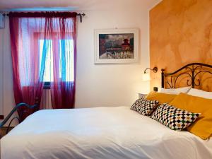 Postel nebo postele na pokoji v ubytování Archetto-casa vacanze
