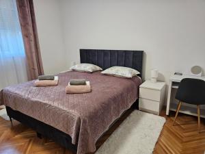 Postel nebo postele na pokoji v ubytování Apartman LARA