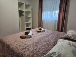 Postel nebo postele na pokoji v ubytování Apartman LARA