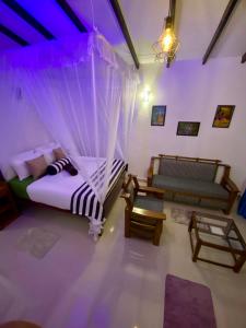Postel nebo postele na pokoji v ubytování Cozy Homestay Waterfall Road Ella