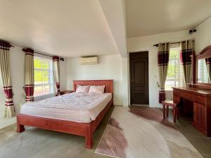 Postel nebo postele na pokoji v ubytování Canopy Residence