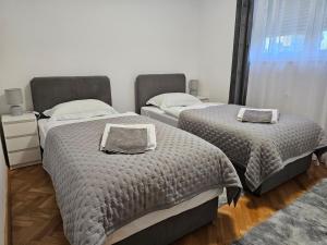 Postel nebo postele na pokoji v ubytování Apartman LARA