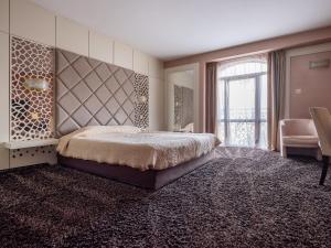 Postel nebo postele na pokoji v ubytování Hotel Concorde + 64 fotografií