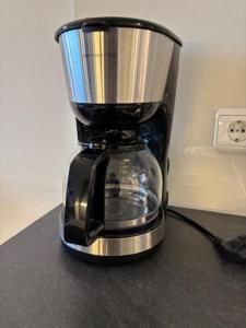 a black blender sitting on top of a counter at Am Südwesthorizont App 185 in Timmendorfer Strand