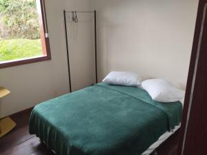 Postel nebo postele na pokoji v ubytování Casinha Aconchego