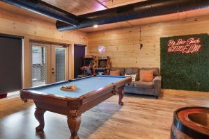 a billiard room with a pool table and a couch at Big Bear Shack - Handicap Accessible & Dog Friendly in Gatlinburg +47 photos
