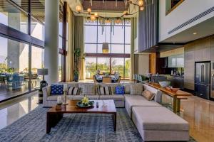 a living room with a couch and a table at 4BD Nuevo Vallarta Luxury Resort w Ocean View in Nuevo Vallarta 