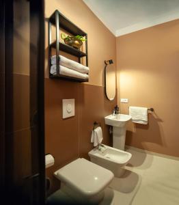 Et badeværelse på MONART HOSPITALITY Vesuvio Park