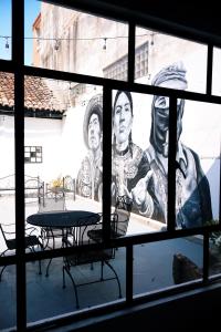 Un televizor și/sau centru de divertisment la Casa Nomada San Cristobal Hostal - Hotel