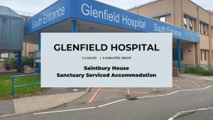 a sign in a parking lot in front of a hospital at Saintbury House in Glenfield