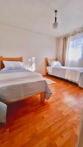 Postel nebo postele na pokoji v ubytování Hostal Casa Terracota