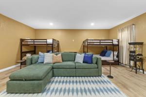 a living room with a couch and two bunk beds at Poolside Fun Games Perfect Family Escape in Largo