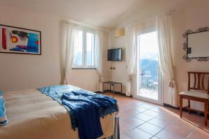 TV a/nebo společenská místnost v ubytování Hotel Al Terra Di Mare