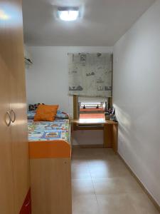 a small room with a bed and a desk at Algaida oropesa in Oropesa del Mar +15 photos