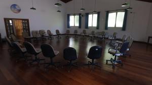 an empty room with chairs and a table at Centro Paulus in Sao Paulo