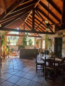 a living room with a table and a couch at Las Veronas in Villa de Las Rosas