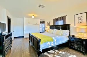 a bedroom with a large bed and a television at Peaceful Retreat in Anaheim-close to Disney in Anaheim +24 photos
