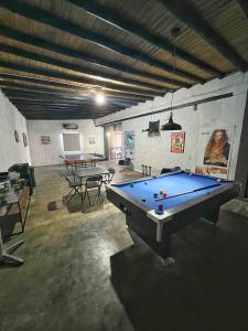 a large room with a pool table in it at Casa a pasos del mar de Playa el Agua in La Loma