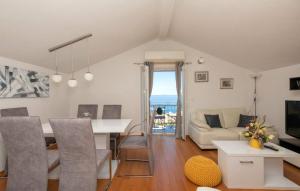 a living room with a table and a couch at Villa Elizabeta Makarska by Villas Guide in Makar