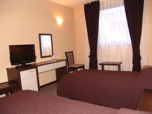 Tempat tidur dalam kamar di Hotel Lovech