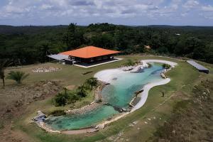 an aerial view of a resort with a beach at Casa Morro da Luz Bahia in Ilha do Tatu