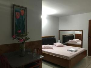 Postel nebo postele na pokoji v ubytování Onix Motel