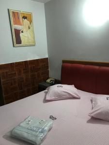Postel nebo postele na pokoji v ubytování Onix Motel