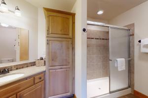 a bathroom with a shower and a sink at Running Bear & Buffalo Run in the Rockies (Master Listing) in Estes Park +42 photos