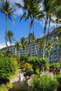 a hotel with palm trees in front of a creek at The Westin Maui Resort & Spa, Ka'anapali in Lahaina