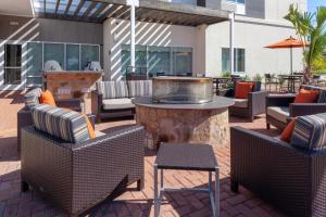 a patio with chairs and a table with a fountain at TownePlace Suites by Marriott San Antonio Westover Hills in San Antonio