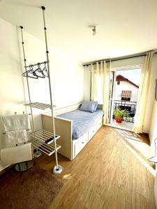 Ένα ή περισσότερα κρεβάτια σε δωμάτιο στο Maison studio duplex Mont Valérien