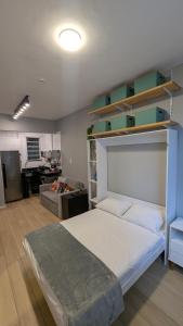 En eller flere senge i et værelse på Studio na Praia de Botafogo