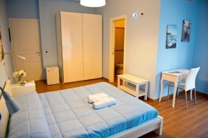 Postel nebo postele na pokoji v ubytování I Delfini