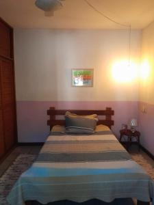 En eller flere senge i et værelse på Casa Aconchegante Porto Segur