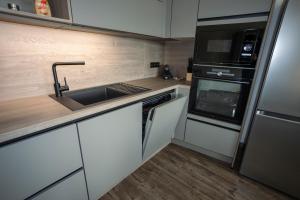 Kuchyň nebo kuchyňský kout v ubytování Apartmán AG