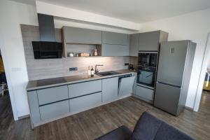 Kuchyň nebo kuchyňský kout v ubytování Apartmán AG