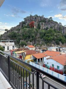 a view of a town with a mountain in the background at Hotel Real in Bom Jesus da Lapa