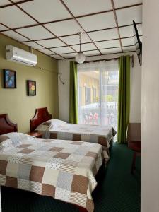 Postel nebo postele na pokoji v ubytování Hotel Malinche