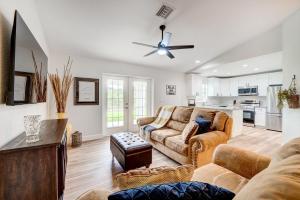 a living room with two couches and a ceiling fan at Golf and Pool Access Pet-Friendly Sebring Home! in Sebring