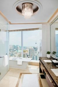 a bathroom with a tub and a large window at The St. Regis Chengdu in Chengdu