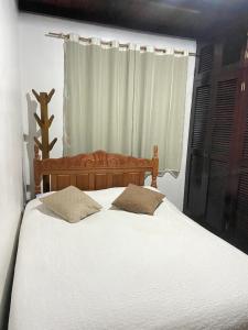 Postel nebo postele na pokoji v ubytování Aconchego - Casinha no Centro de Arraial do Cabo