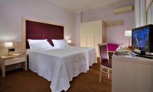 Postel nebo postele na pokoji v ubytování Hotel Terme Marco Polo