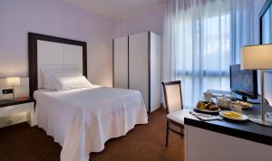 Postel nebo postele na pokoji v ubytování Hotel Terme Marco Polo